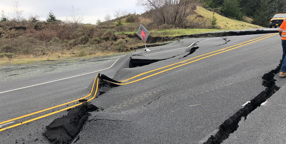 A photo showing road damage from the Hooskanadan Landslide in Oregon.