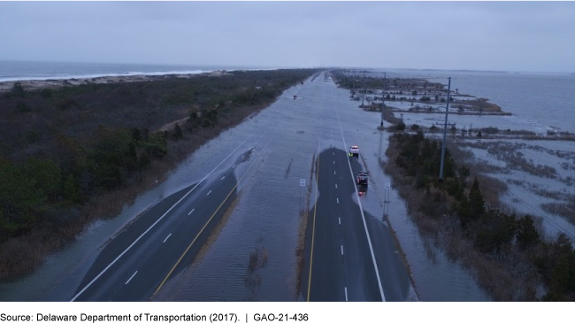 A picture showing a flooded road in Delaware.